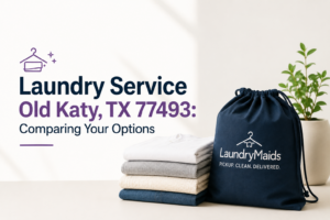 Stack of folded clothes and a LaundryMaids bag on a table with text: Laundry Service Old Katy TX 77493: Comparing Your Options. A small plant sits in the background, highlighting convenient pickup laundry service for busy residents.